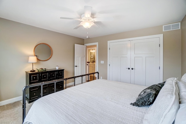 bedroom featuring baseboards, visible vents, ceiling fan, carpet floors, and a closet