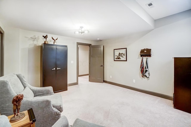 living area with light carpet, visible vents, and baseboards