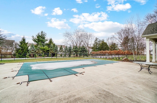 view of pool featuring a patio, fence, and a fenced in pool