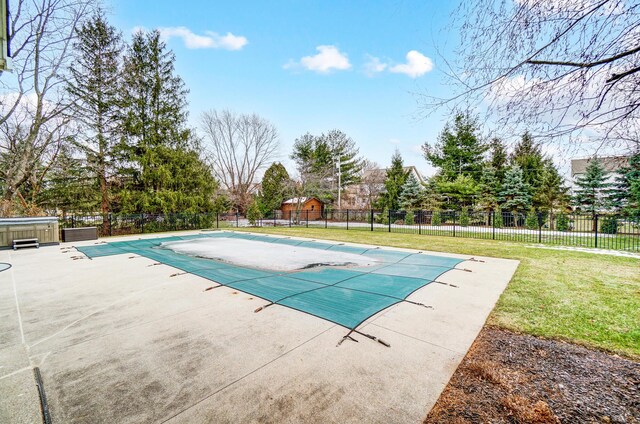 view of swimming pool featuring a fenced in pool, a patio area, a lawn, and fence