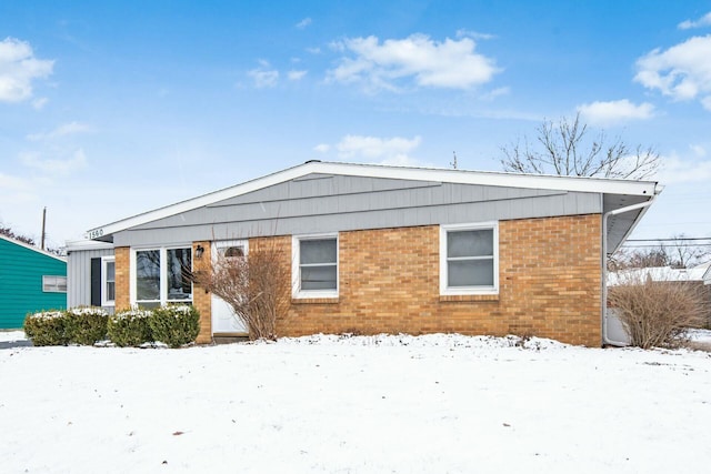 view of snow covered house