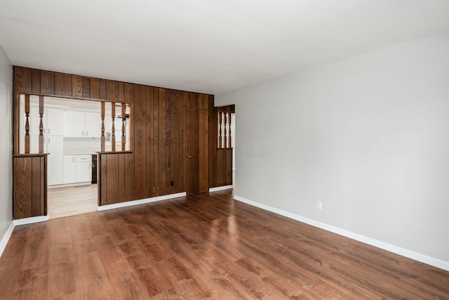 empty room with light hardwood / wood-style flooring