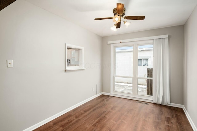 empty room featuring ceiling fan and hardwood / wood-style flooring