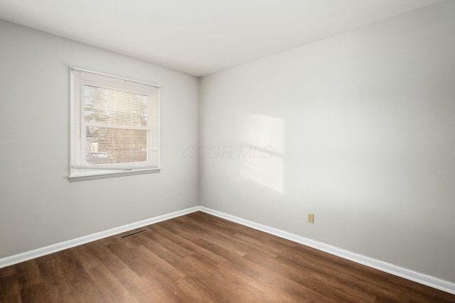 empty room featuring hardwood / wood-style floors