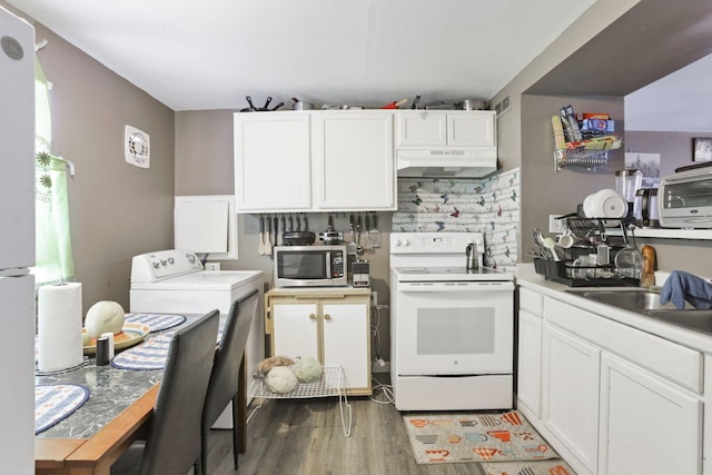 kitchen with white cabinets, washer / clothes dryer, white range with electric cooktop, sink, and hardwood / wood-style flooring