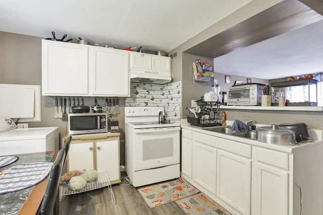 kitchen with white range with electric cooktop, dark hardwood / wood-style floors, washer and dryer, and white cabinetry