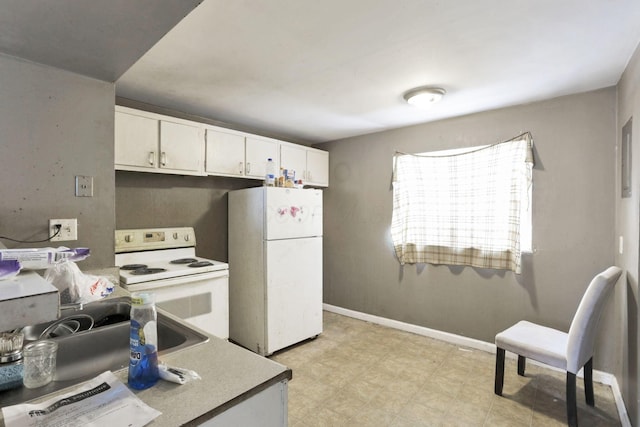 kitchen featuring white cabinetry and white appliances