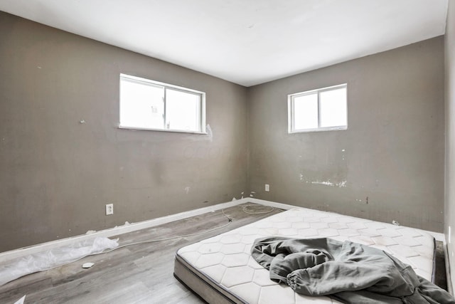 bedroom with wood-type flooring