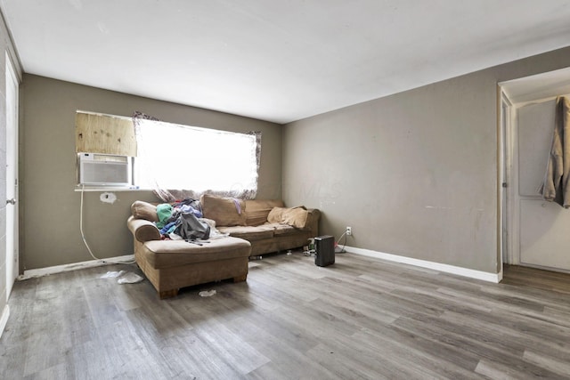 living room featuring cooling unit and hardwood / wood-style floors