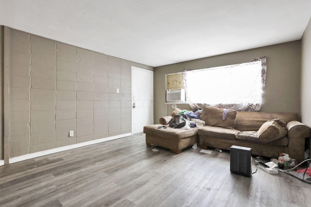 living room featuring cooling unit and hardwood / wood-style floors