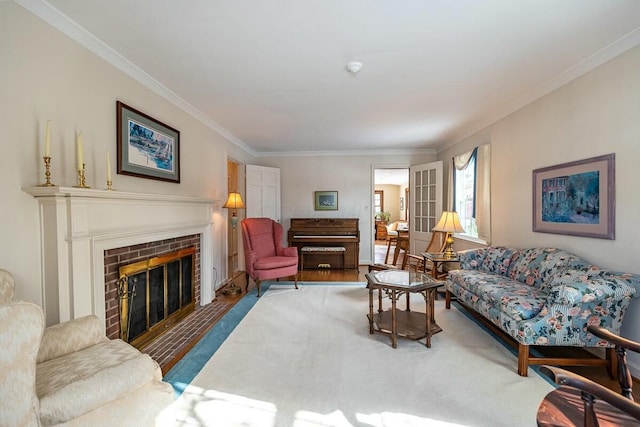 living room with a brick fireplace and crown molding