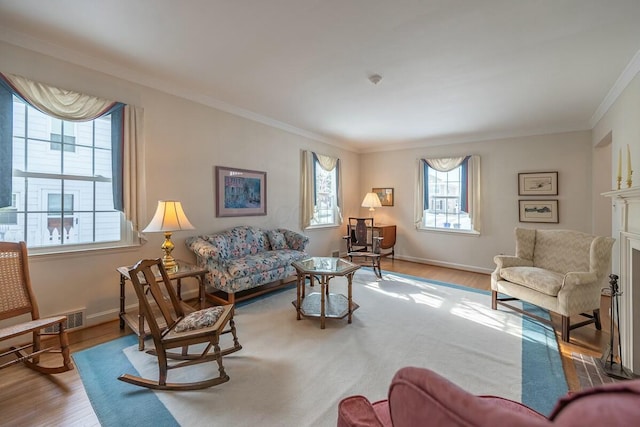 living room featuring light wood-type flooring and crown molding