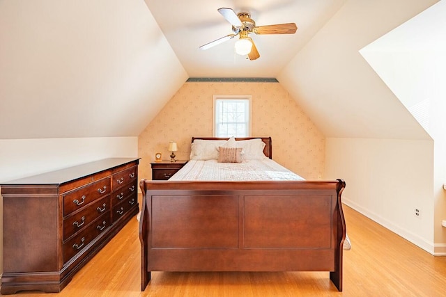 bedroom featuring lofted ceiling, ceiling fan, and light hardwood / wood-style floors