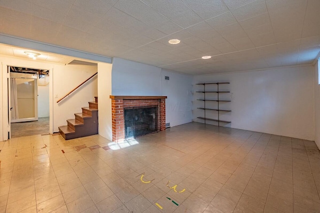 unfurnished living room with a brick fireplace