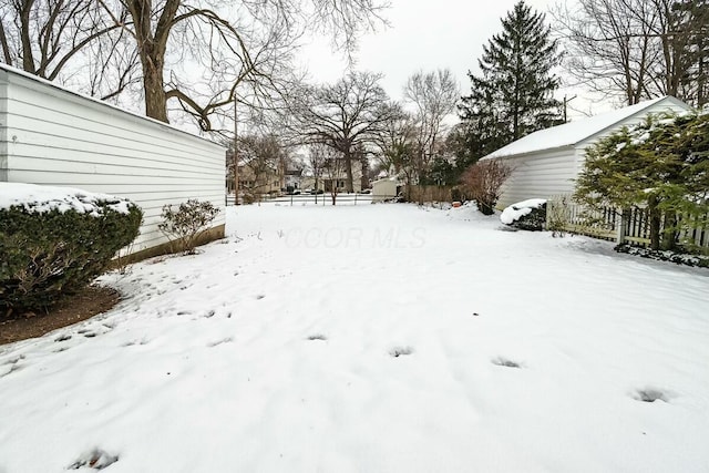 view of yard covered in snow