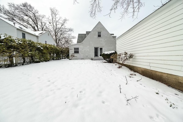 view of snow covered house