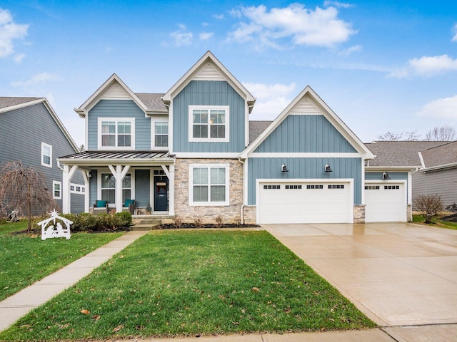 craftsman house featuring a garage, a porch, and a front yard