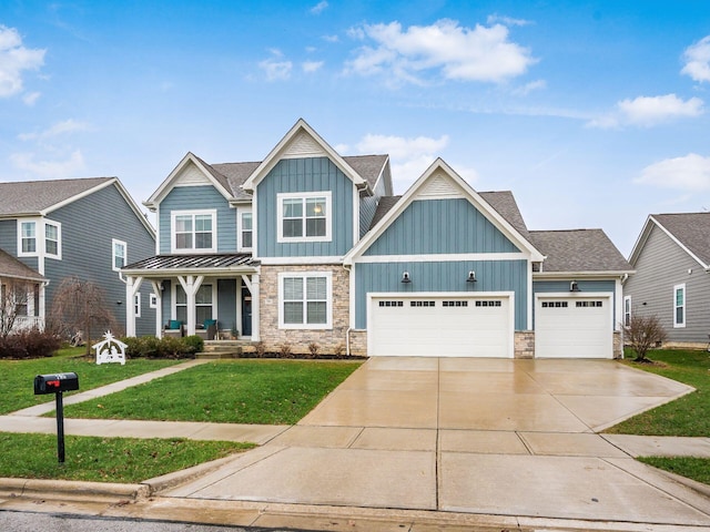 craftsman-style home featuring a garage, covered porch, and a front lawn