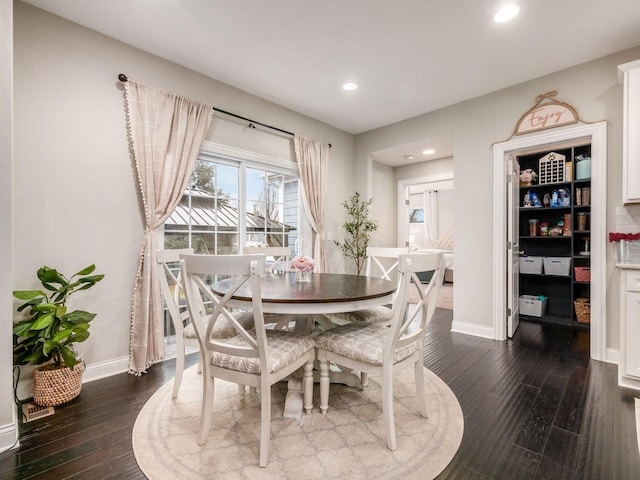 dining room featuring dark wood-type flooring