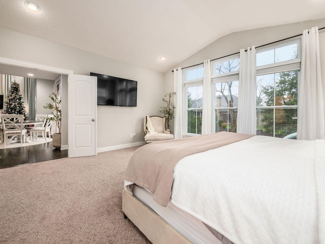 carpeted bedroom with vaulted ceiling