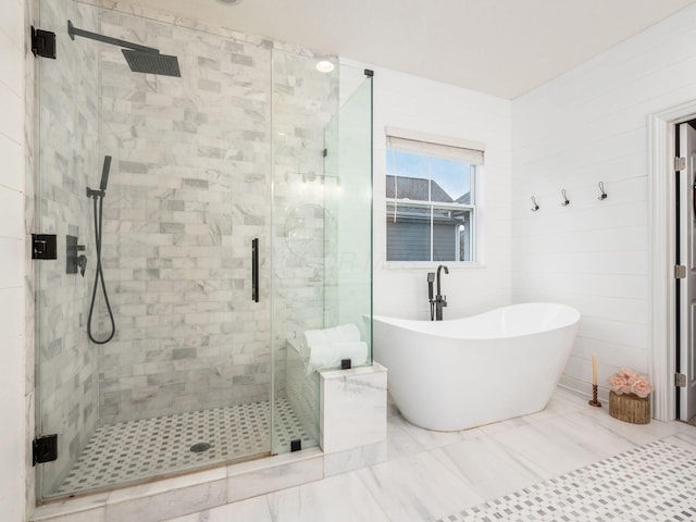 bathroom with separate shower and tub