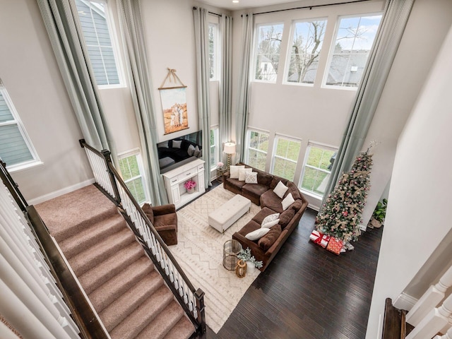 living room featuring a wealth of natural light and wood-type flooring