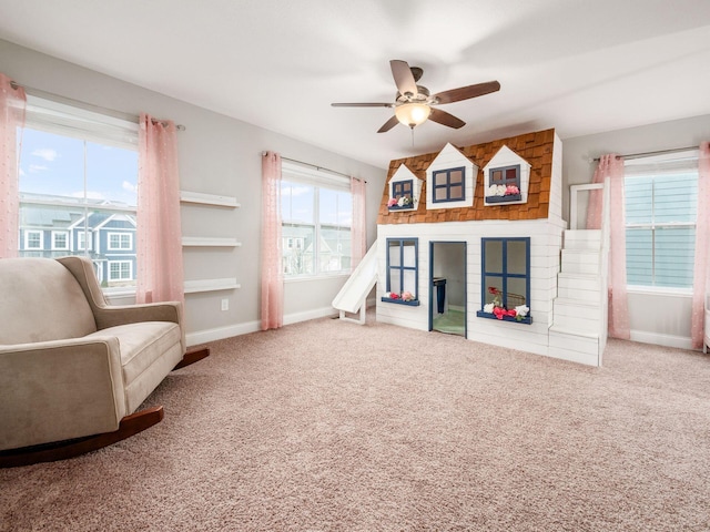 game room with carpet flooring and ceiling fan