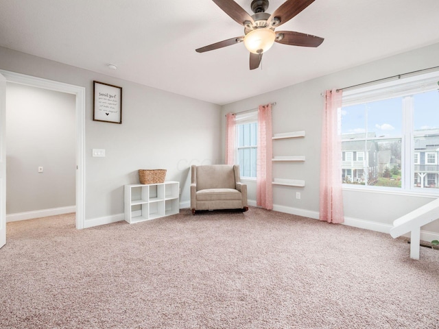 sitting room featuring carpet flooring and ceiling fan