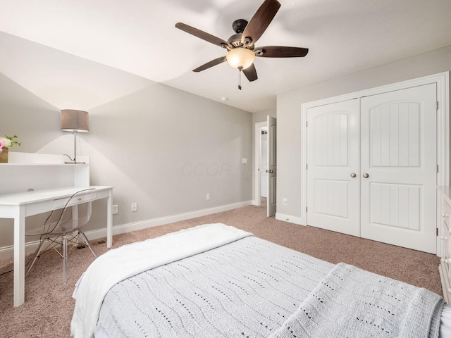 carpeted bedroom featuring ceiling fan and a closet