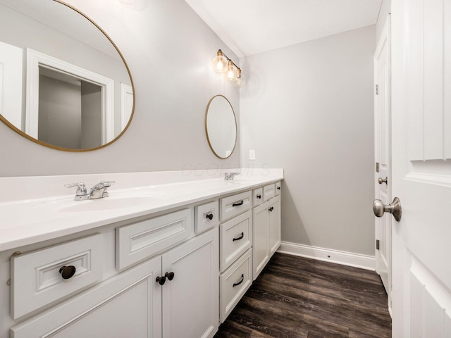 bathroom with hardwood / wood-style floors and vanity