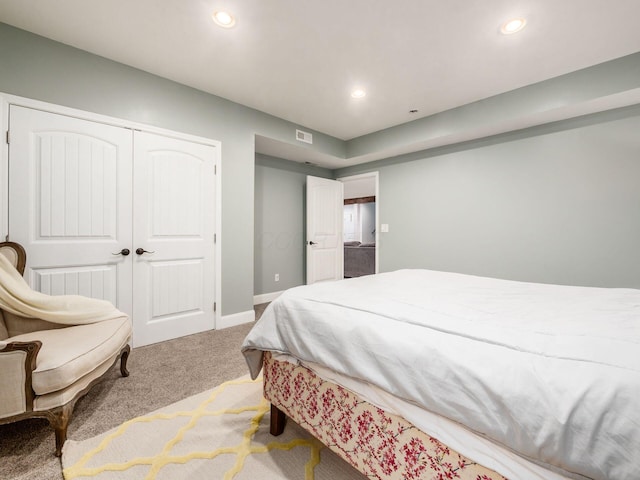 bedroom with carpet floors and a closet