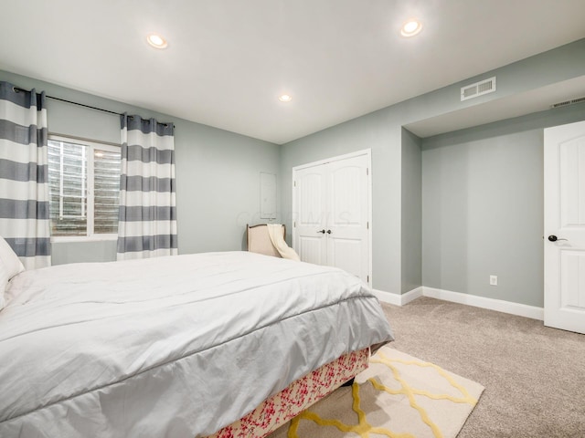 carpeted bedroom with a closet