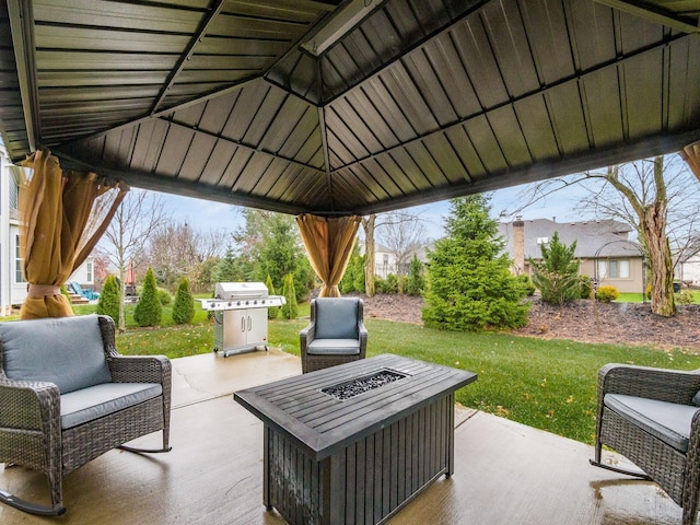 view of patio featuring a gazebo, a grill, and a fire pit