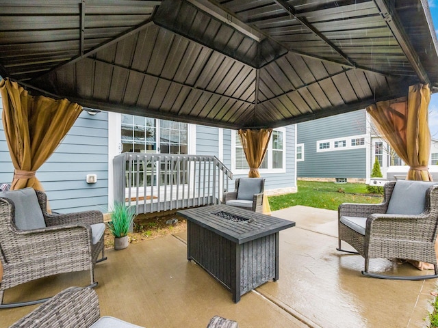 view of patio featuring a gazebo and an outdoor fire pit