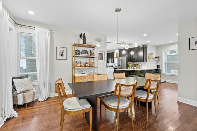 dining area with dark wood-type flooring