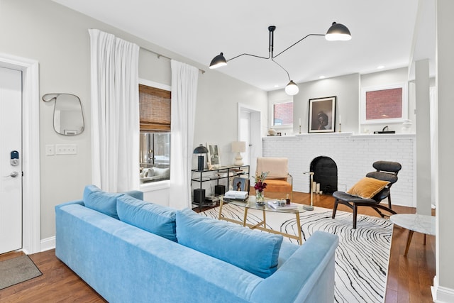 living room featuring dark wood-type flooring