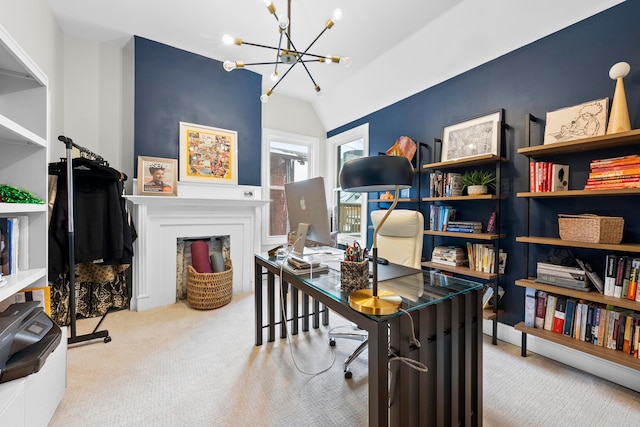 office space with an inviting chandelier, light colored carpet, and vaulted ceiling