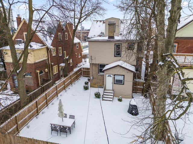 view of snow covered house