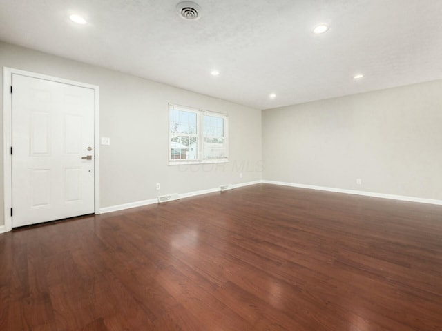 interior space with dark hardwood / wood-style floors