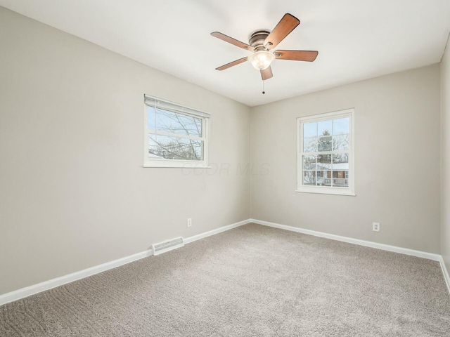 carpeted empty room with ceiling fan