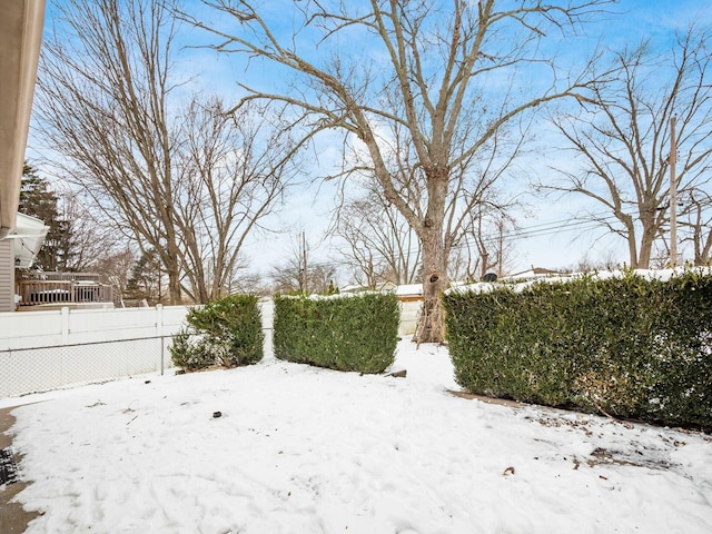 view of yard layered in snow