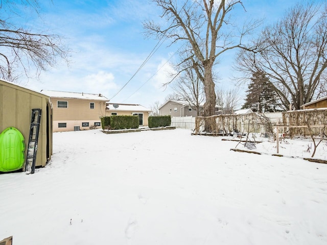 view of yard covered in snow