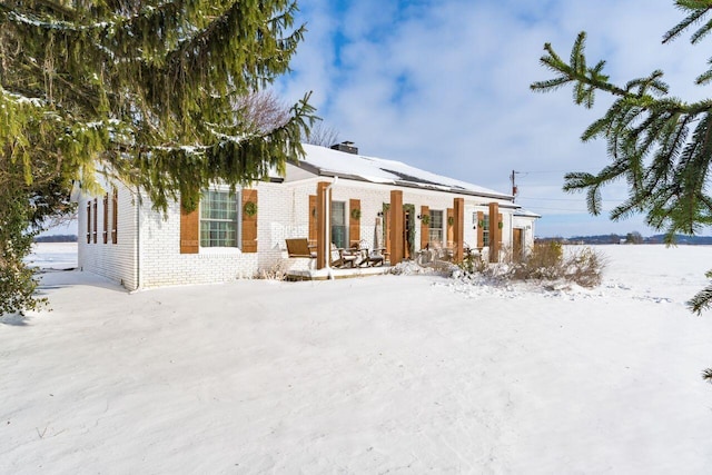 view of snow covered house