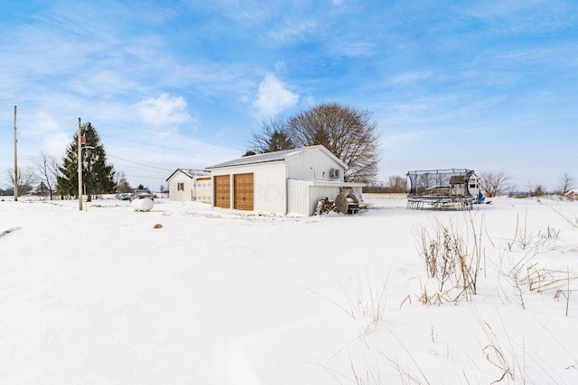 exterior space featuring an outbuilding and a trampoline