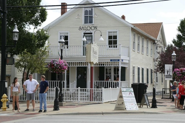 view of front of home with a balcony