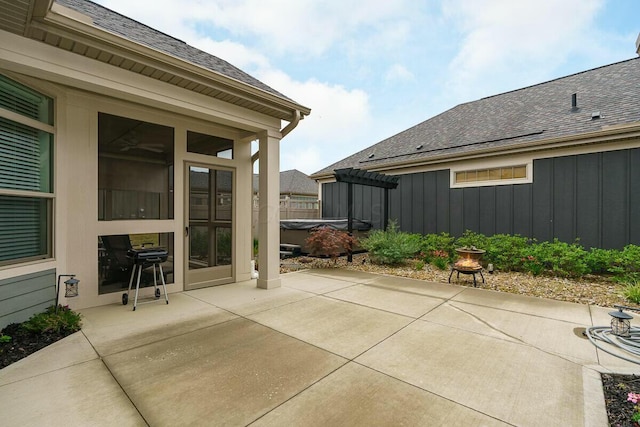 view of patio featuring a grill and a hot tub