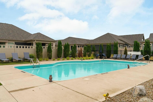 view of swimming pool with a patio area