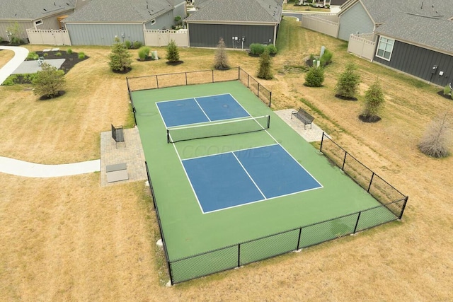 view of tennis court with basketball hoop