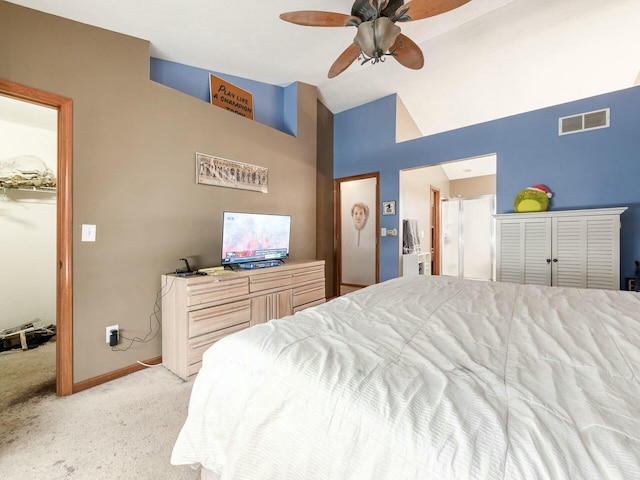 bedroom featuring ceiling fan, light colored carpet, and vaulted ceiling