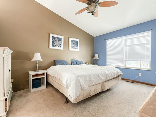 bedroom featuring ceiling fan, light carpet, and lofted ceiling